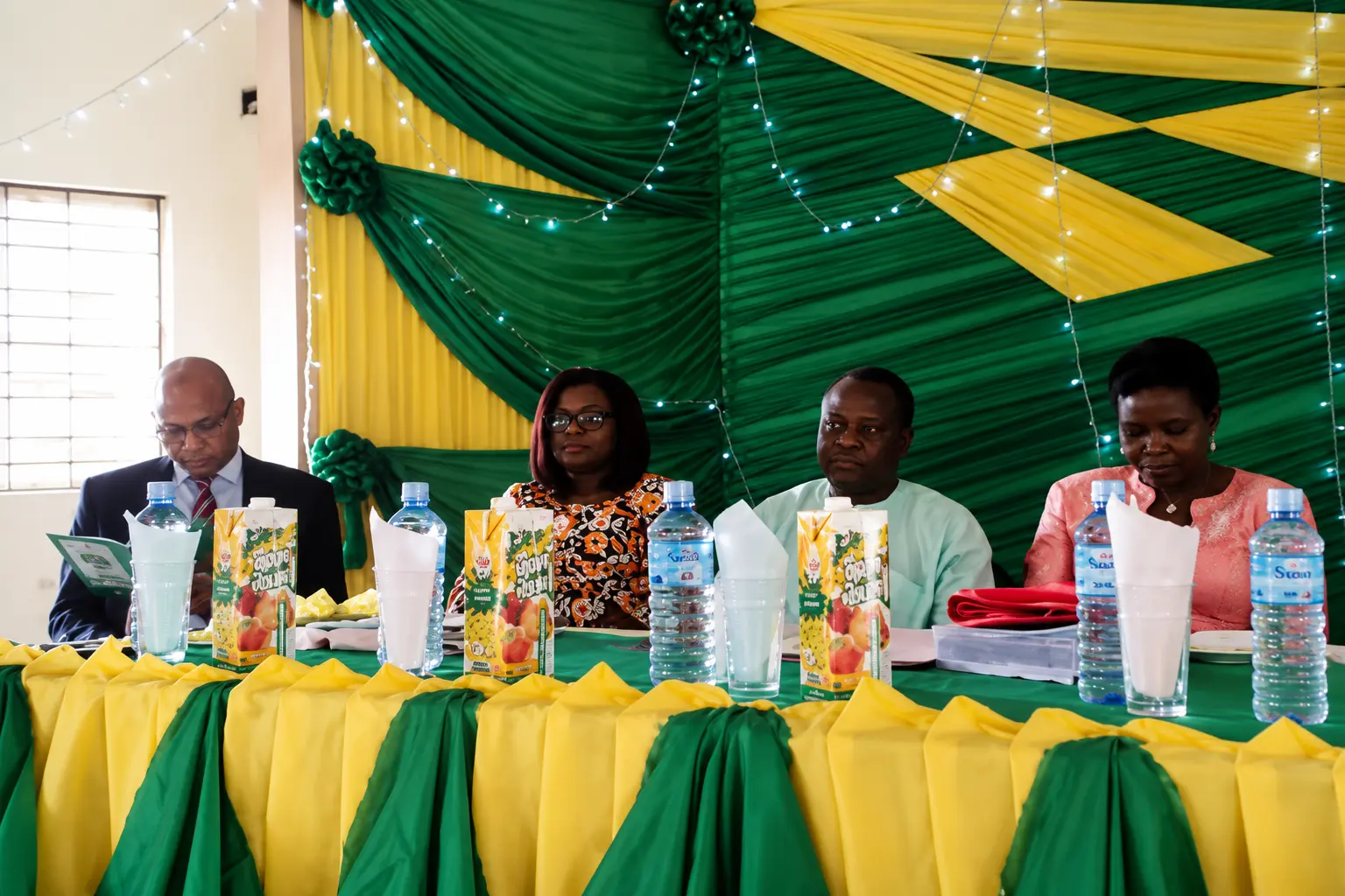 High table at a chapter event in green and gold